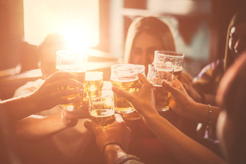 Group of teens having fun in a pub