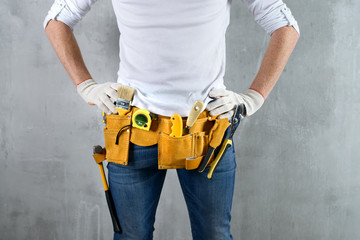 Fototapeta na wymiar belt builder close-up men's hands on the waist