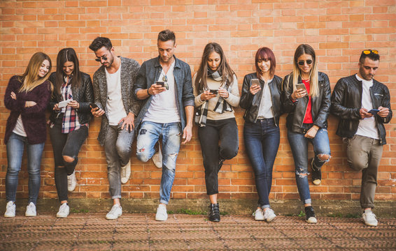 Group of teenagers with smartphone outdoor