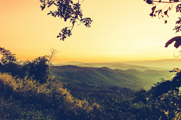 Fototapeta na wymiar Scenic view of sunrise mountains at northeast Thailand, Mountain range for climbing in mountain trails. the landscape of mountain which including of copy-space for texting. 