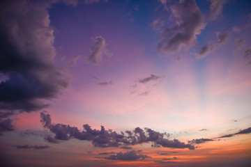 Nature in twilight period which including of sunrise over the sea and the nice beach. Summer beach with blue water and purple sky at the sunset.