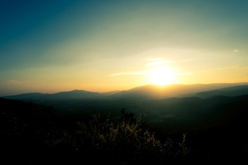 Scenic view of sunrise mountains at northeast Thailand, Mountain range for climbing in mountain trails. the landscape of mountain which including of copy-space for texting. 