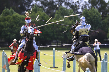 Two medieval knights confront during jousting tournament