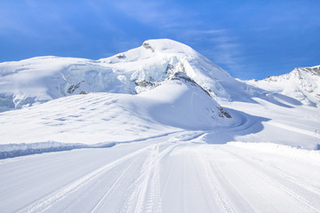Fototapeta na wymiar Ski Tracks in a Swiss mountains in Saas-Fee