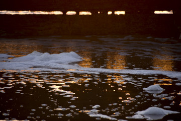 Water and foam at sunset