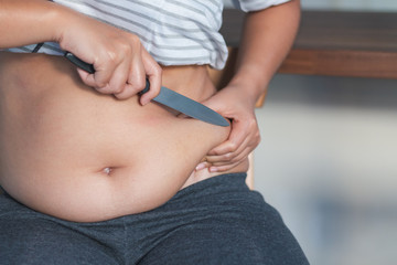 A fat woman cut of big belly