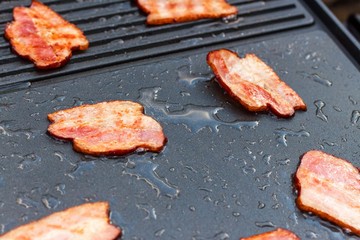 Meat on an electric grill. Home cooking. Healthy barbecue. Catering to friends. Electric grilling.