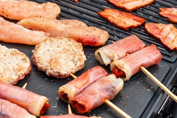 Meat on an electric grill. Home cooking. Healthy barbecue. Catering to friends. Electric grilling.
