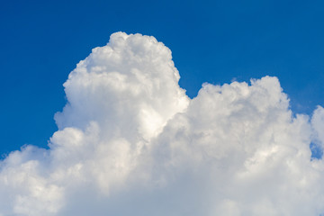Naklejka na ściany i meble white clouds on a blue sky, background