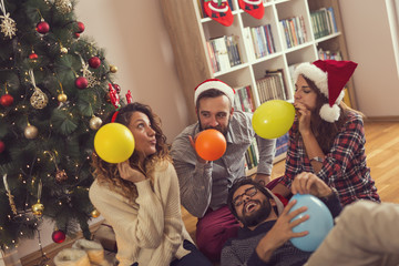 Blowing balloons for Christmas party