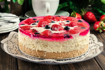 Cheesecake with strawberries, blueberry and jelly