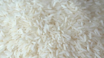 Slow motion of close up falling raw rice / uncook rice. (High speed video) - Powered by Adobe