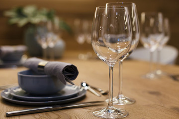 Two Glasses of White Wine on dining table in the restaurant, blurred bokeh background. 