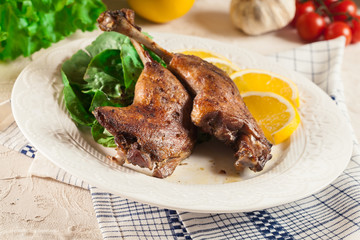 Duck legs confit with orange and salad
