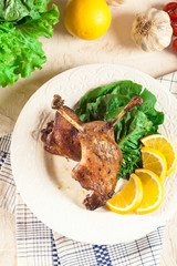 Duck legs confit with orange and salad