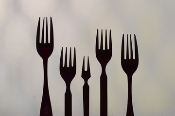 symbolic arrangement of fork representing love and family black and white silhouette