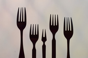 symbolic arrangement of fork representing love and family black and white silhouette