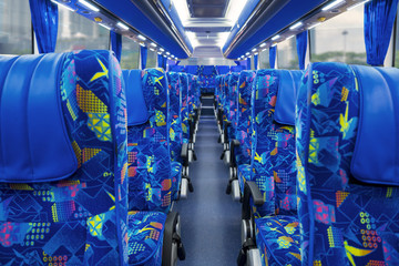 Travel bus interior with passenger seats © Creativa Images