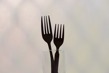 symbolic arrangement of fork representing love and family black and white silhouette