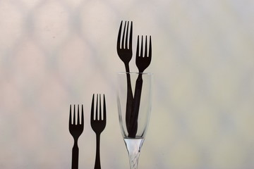 symbolic arrangement of fork representing love and family and society black and white silhouette