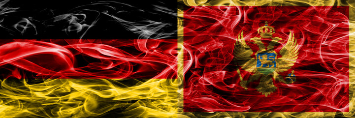 Germany vs Montenegro smoke flags placed side by side. German and Montenegro flag together
