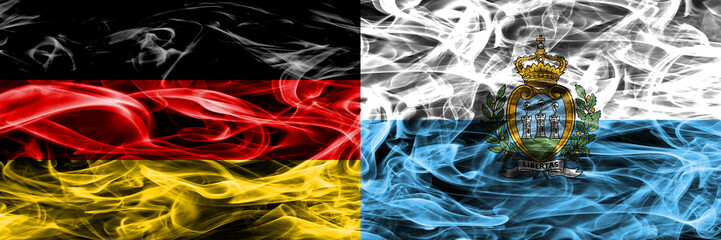 Germany vs San Marino smoke flags placed side by side. German and San Marino flag together