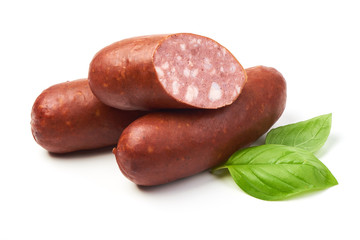 Smoked sausages for grill with basil herb, isolated on white background.