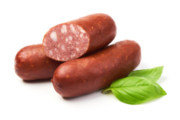 Smoked sausages with sausage slices and basil herb, isolated on white background.