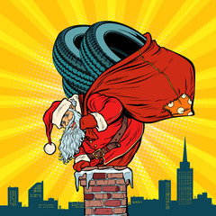 car winter tires. Santa Claus with gifts climbs into the chimney