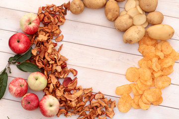 Dried apples. Healthy snack. Potato chips, unhealthy food. Place for text.