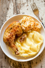 Roasted chicken leg with mashed potatoes and coleslaw  