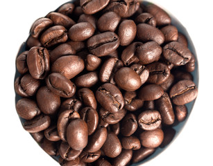 Grains of coffee on white background, close-up. View from above.