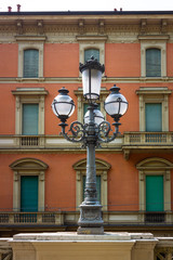 Street light and building facade in Bologna, Italy