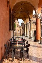Restaurant seating in one of Bologna's many colonnades / porticos © Clare
