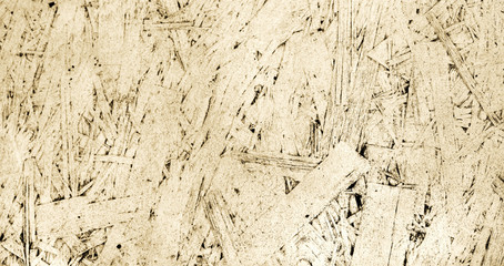 Painted texture of oriented strand board, OSB, light background from pressed wooden panel.