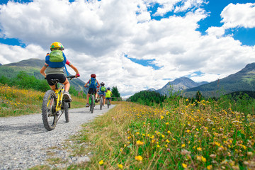 Group of children during a bike ride in the mountains - 218595489