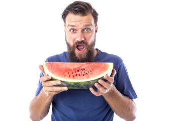 Bearded man eating watermelon