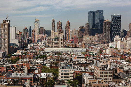 Skyline Of Hells Kitchen In New York City During A Summer Day With Blue Sky