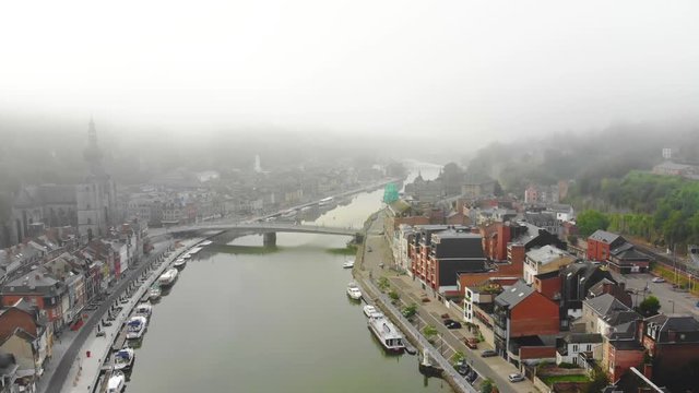 flight over city on river bank