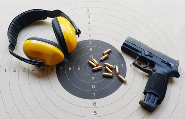 gun and ammunition on the target