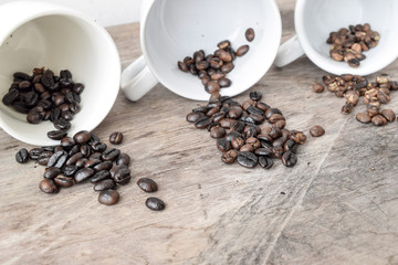 Roasted coffee beans of three different level in black bow on grunge wooden background,Coffee bean 3 level roast