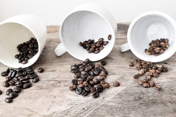 Roasted coffee beans of three different level in black bow on grunge wooden background,Coffee bean...