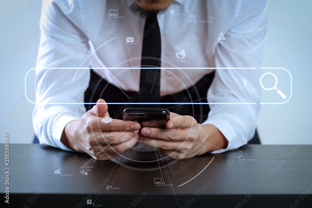Poster close up of businessman working with smart phone on wooden desk in modern office with virtual icon d