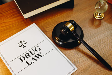 Drug Law legal documents with gavel at the side