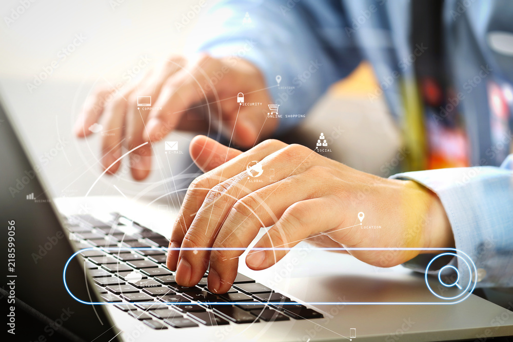 Poster close up of businessman typing keyboard with laptop computer on wooden desk in modern office with vi
