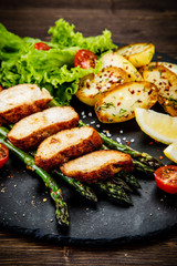 Roast chicken fillets and vegetables
