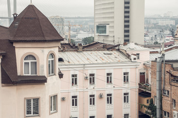 a city view with houses and abridge from a rooftop