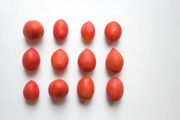 Ripe plum tomatoes isolated on white background from a high angle view