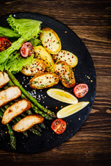 Roast chicken fillets and vegetables