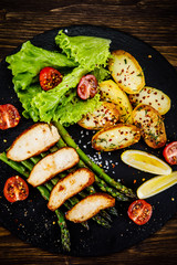 Roast chicken fillets and vegetables